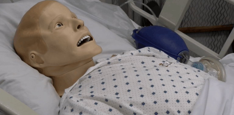 Mannequins programmed with COVID-19 symptoms help doctors practice skills ahead of surge